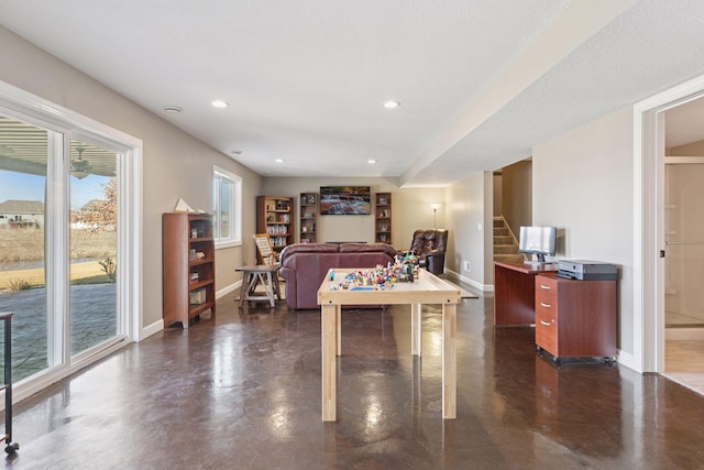 game room featuring recessed lighting, baseboards, and finished concrete floors