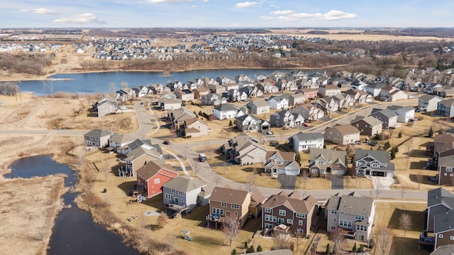 bird's eye view featuring a water view and a residential view