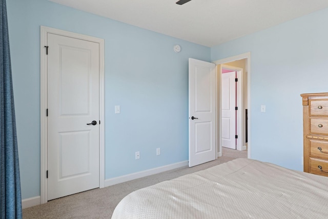 bedroom featuring carpet floors and baseboards