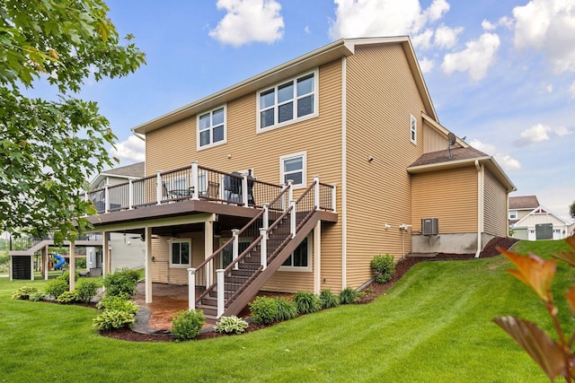 4520 Bailey Lake Dr, Woodbury, MN 55129 - rear view of property featuring a deck, stairway, a lawn, a patio area, and central air condition unit