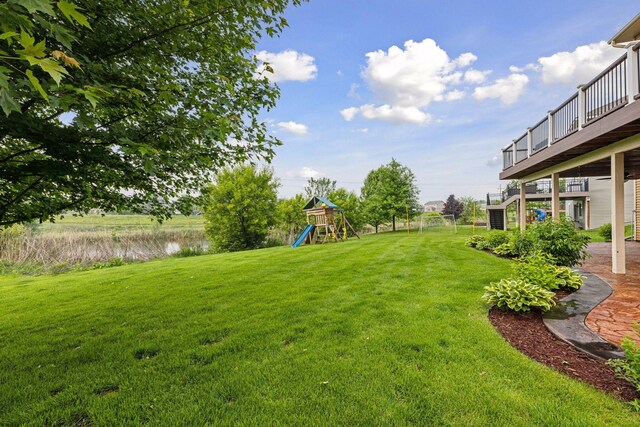 4520 Bailey Lake Dr, Woodbury, MN 55129 - view of grassy yard with a playground and a water view