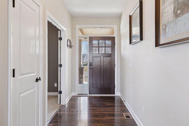 4520 Bailey Lake Dr, Woodbury, MN 55129 - foyer entrance featuring dark wood finished floors and baseboards