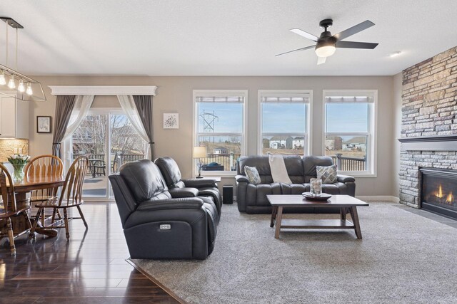 4520 Bailey Lake Dr, Woodbury, MN 55129 - living room featuring a ceiling fan and a fireplace