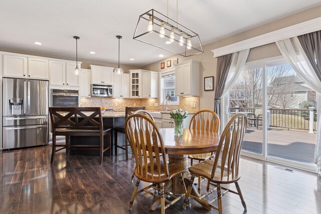 4520 Bailey Lake Dr, Woodbury, MN 55129 - dining room with dark wood-style flooring and recessed lighting