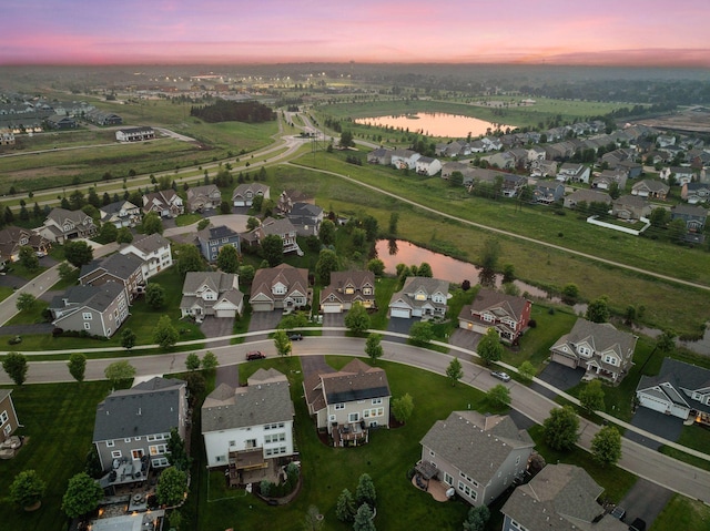 4520 Bailey Lake Dr, Woodbury, MN 55129 - aerial view at dusk of a water view and a residential view
