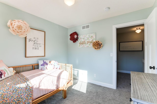 carpeted bedroom featuring baseboards and visible vents