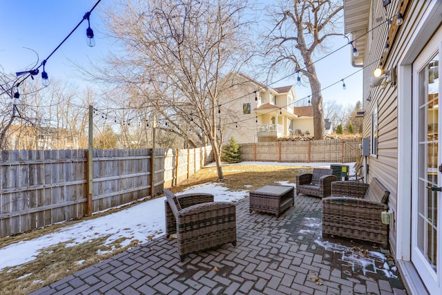 view of patio featuring an outdoor hangout area and a fenced backyard