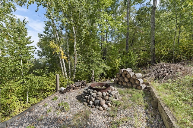 view of yard with a fire pit