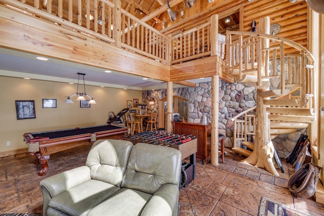 playroom featuring recessed lighting, stone tile floors, pool table, a towering ceiling, and log walls