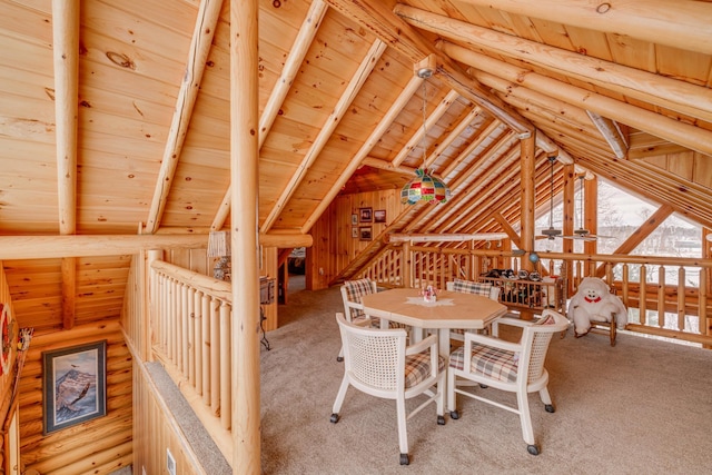 interior space with lofted ceiling with beams, wooden ceiling, and log walls