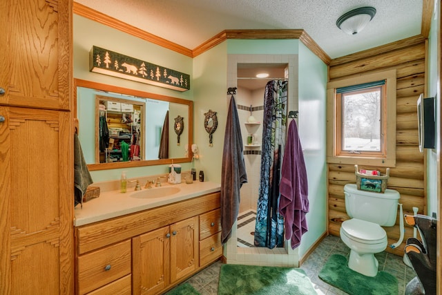 bathroom with toilet, vanity, curtained shower, crown molding, and a textured ceiling