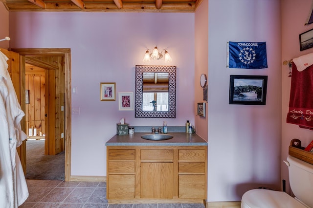 bathroom featuring vanity, toilet, and tile patterned floors