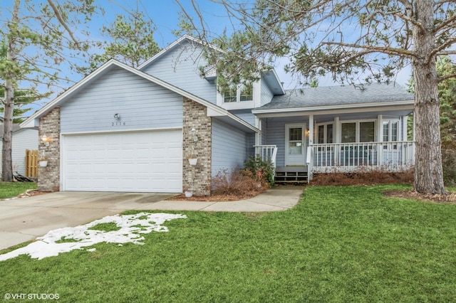 view of front of house with an attached garage, brick siding, covered porch, and a front lawn