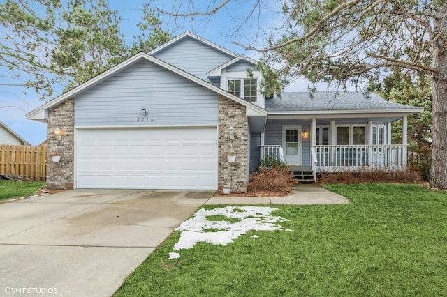 traditional-style home with brick siding, a porch, an attached garage, and a front yard