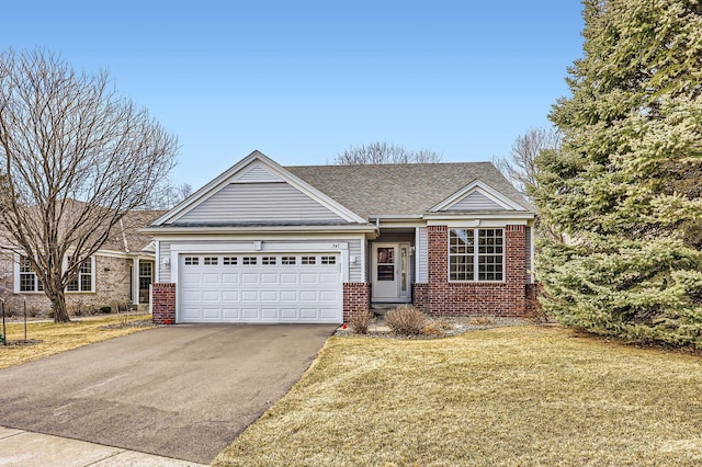 single story home with brick siding, a shingled roof, a front lawn, aphalt driveway, and a garage