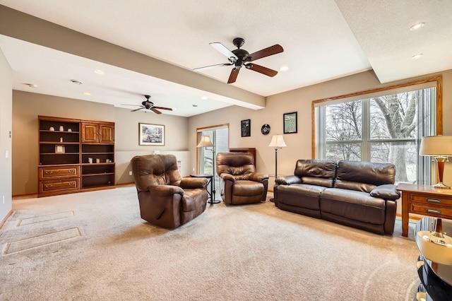 living room with recessed lighting, light carpet, beam ceiling, and a ceiling fan
