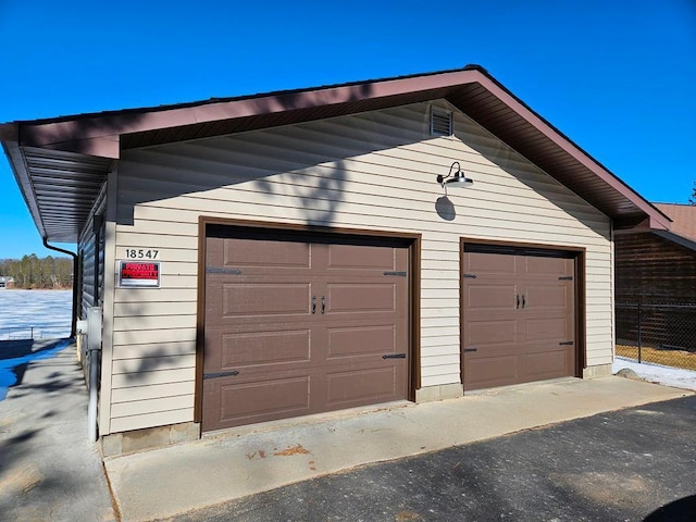 garage featuring fence