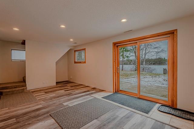 entryway with recessed lighting and wood finished floors