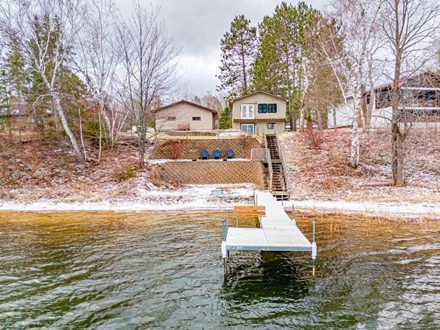 dock area with stairs and a water view