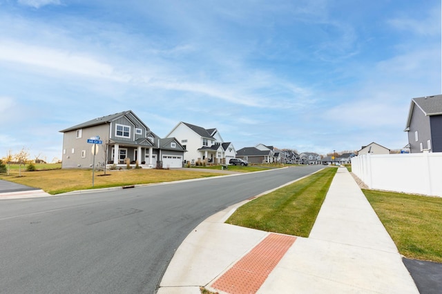 view of road with a residential view and sidewalks