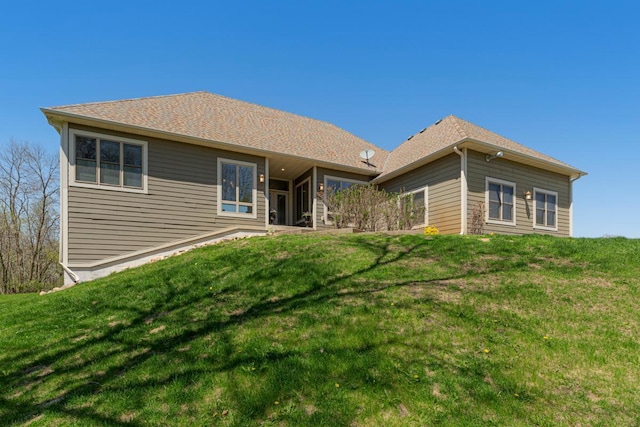 back of property with a yard
