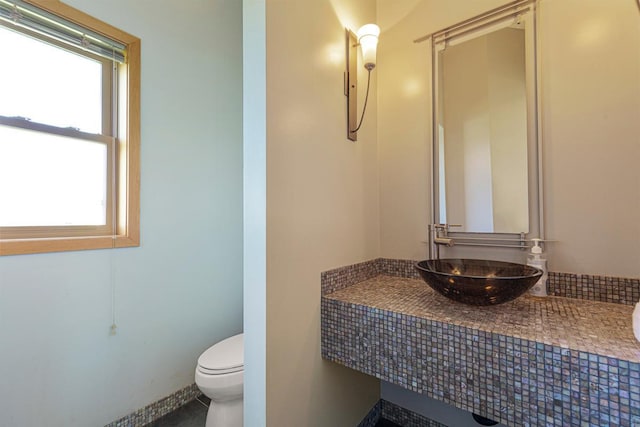 bathroom with a sink and toilet