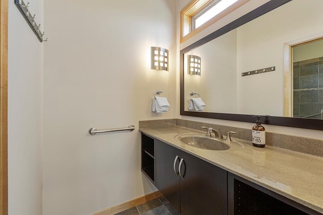 bathroom featuring vanity and baseboards