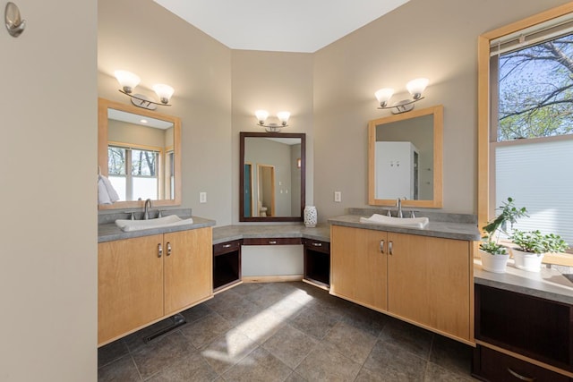 full bathroom featuring two vanities