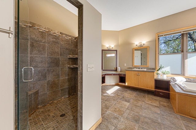 full bathroom featuring a stall shower, a garden tub, and vanity
