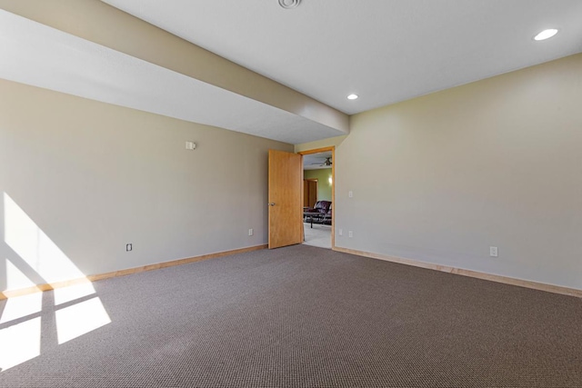spare room featuring carpet flooring, recessed lighting, baseboards, and a ceiling fan