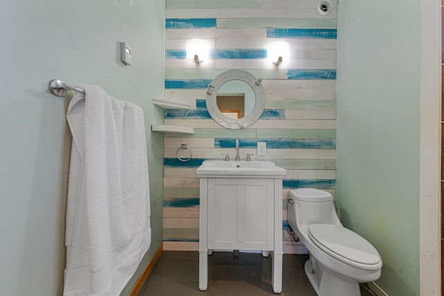 bathroom with toilet and vanity