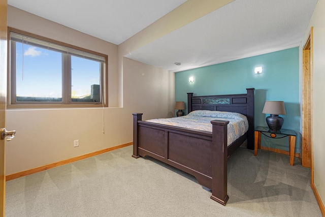 bedroom with carpet flooring and baseboards