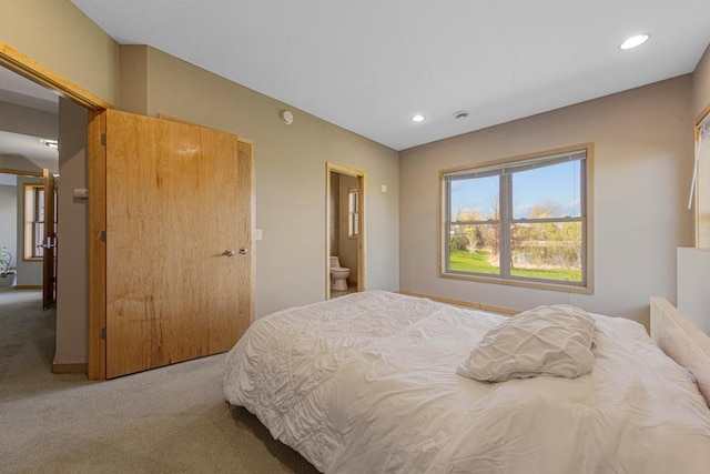 carpeted bedroom featuring recessed lighting and baseboards