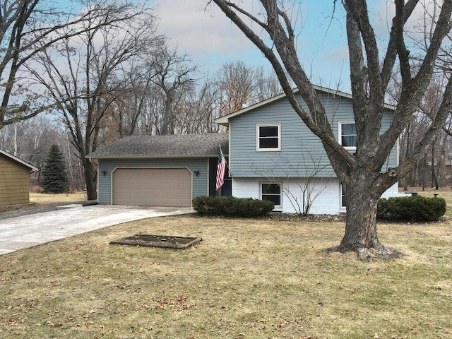 15015 Vermillion Cir NE, Andover, MN 55304 - split level home featuring a garage, driveway, and a front lawn