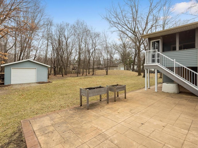 15015 Vermillion Cir NE, Andover, MN 55304 - view of patio featuring an outdoor structure, a garage, stairs, and a sunroom
