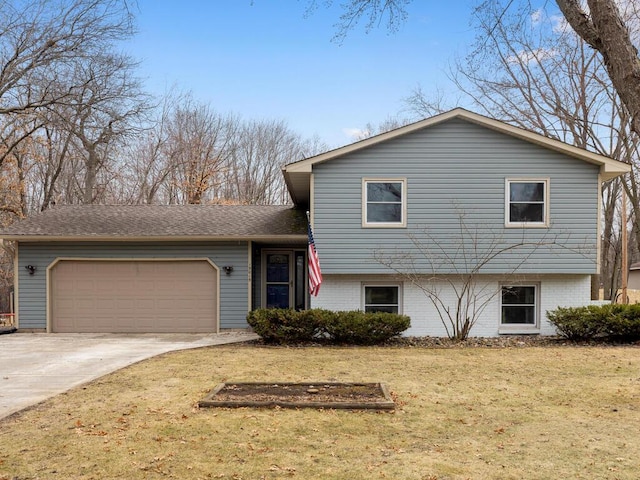 15015 Vermillion Cir NE, Andover, MN 55304 - tri-level home with an attached garage, a front yard, driveway, and brick siding