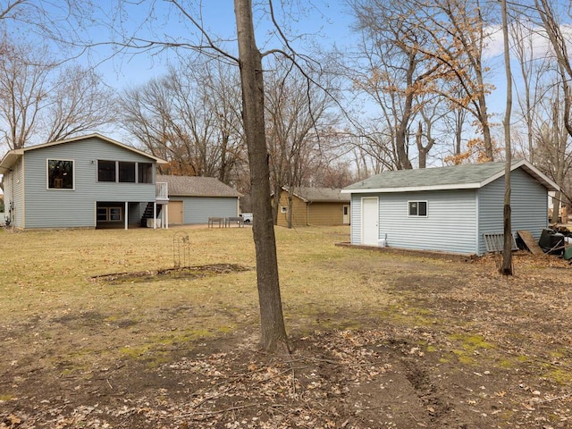 15015 Vermillion Cir NE, Andover, MN 55304 - view of green lawn featuring a sunroom and an outbuilding