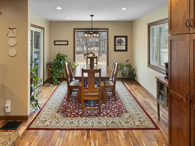 15015 Vermillion Cir NE, Andover, MN 55304 - dining room with light wood-type flooring, a chandelier, baseboards, and recessed lighting