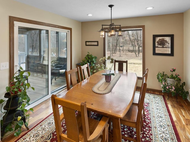 15015 Vermillion Cir NE, Andover, MN 55304 - dining space with wood finished floors, a chandelier, recessed lighting, and baseboards
