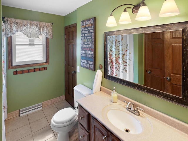 15015 Vermillion Cir NE, Andover, MN 55304 - bathroom featuring tile patterned flooring, toilet, vanity, and baseboards