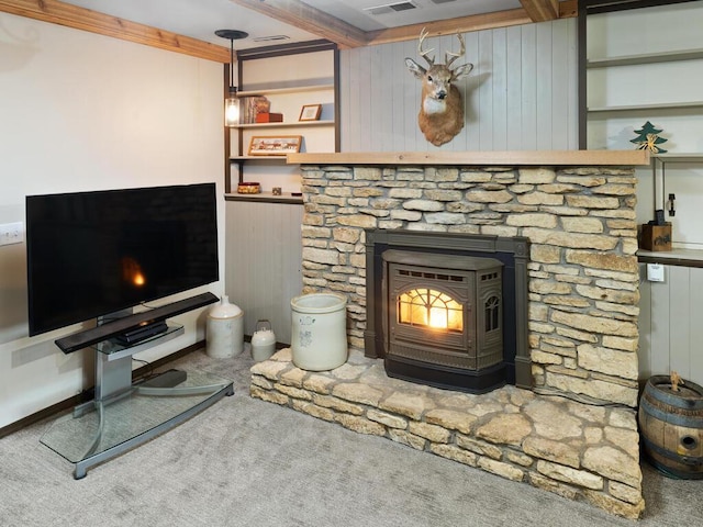 15015 Vermillion Cir NE, Andover, MN 55304 - living area with carpet floors, a wood stove, and wooden walls