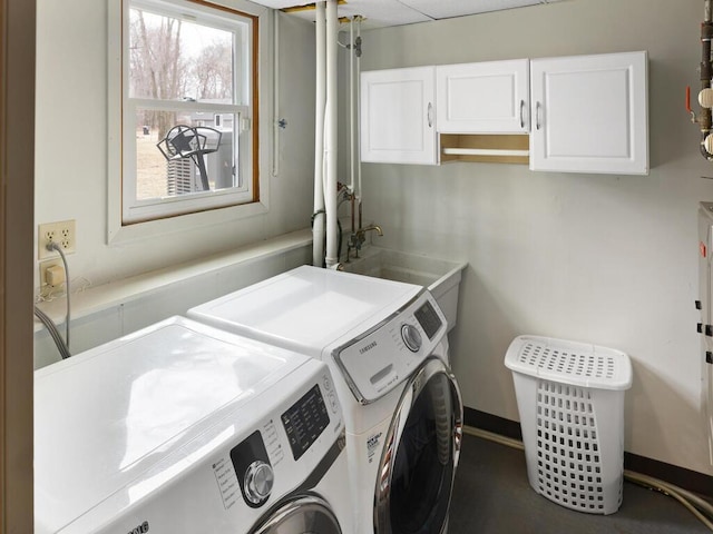 15015 Vermillion Cir NE, Andover, MN 55304 - washroom with washer and clothes dryer, cabinet space, and baseboards
