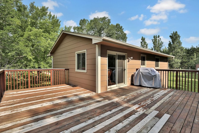 wooden terrace featuring grilling area