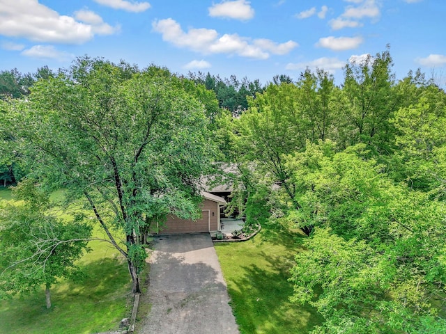 aerial view featuring a wooded view