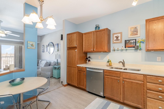 kitchen with light countertops, stainless steel dishwasher, a sink, and brown cabinets