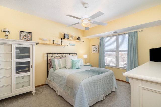 bedroom featuring baseboards, visible vents, and light colored carpet