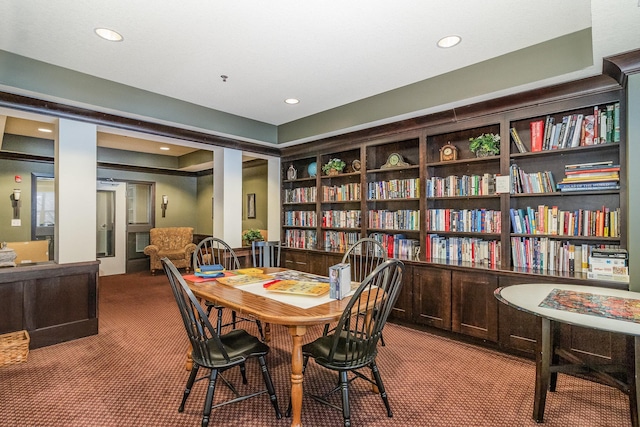 carpeted dining space featuring built in shelves and recessed lighting