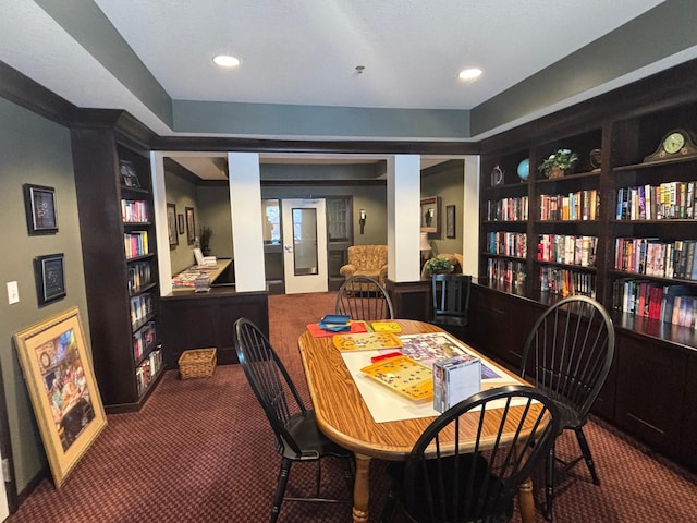 carpeted dining area featuring built in features, recessed lighting, and french doors