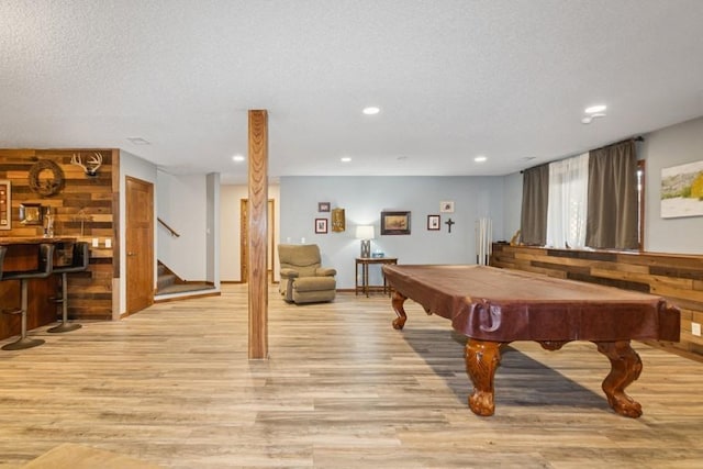 rec room with recessed lighting, a textured ceiling, billiards, and light wood-style floors