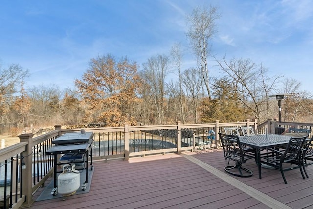 deck featuring outdoor dining area